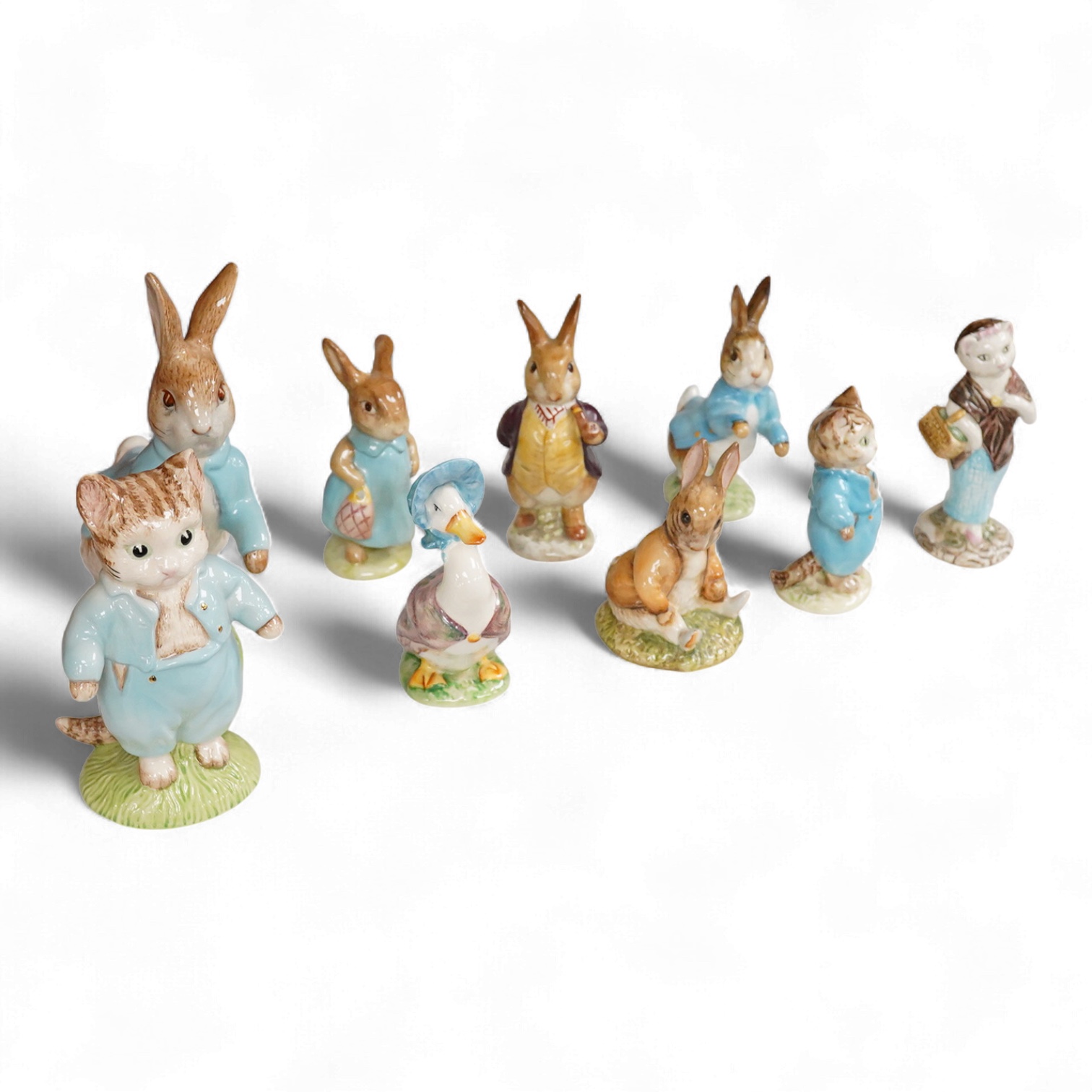Nine Beswick Beatrix Potter figures, some stamped F. Warne & Co , largest 17cm high